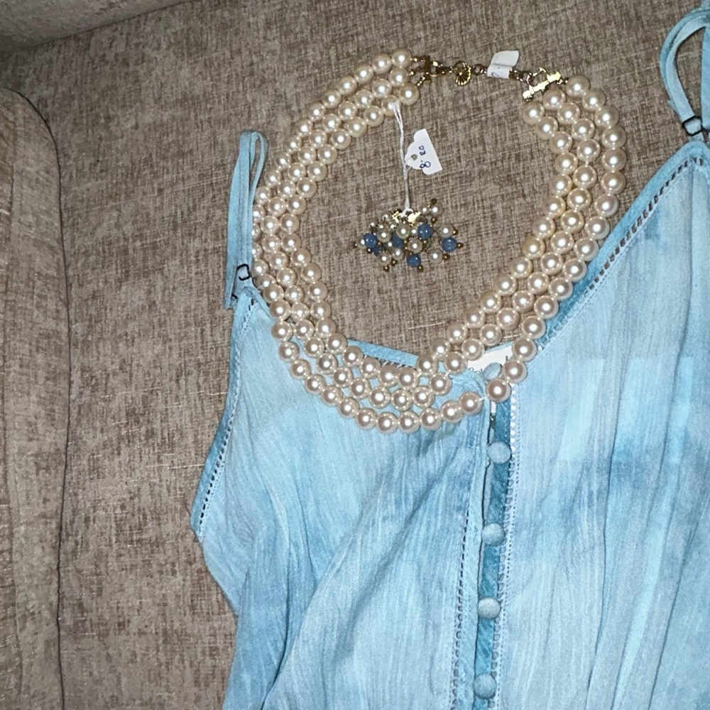 Blue Sleeveless Dress with Pearl Necklace and many other pieces of jewelry